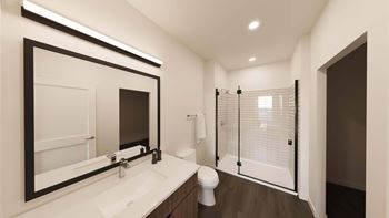 Bathroom with glass shower and framed mirror